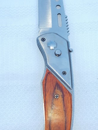 Coltello ad apertura meccanica